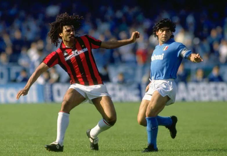 Diego Maradona battles dribbles against Ruud Gullit of AC Milan in the Serie A in 1988